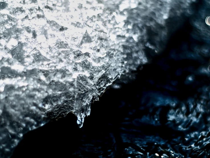 the corner of a piece of ice on a beach