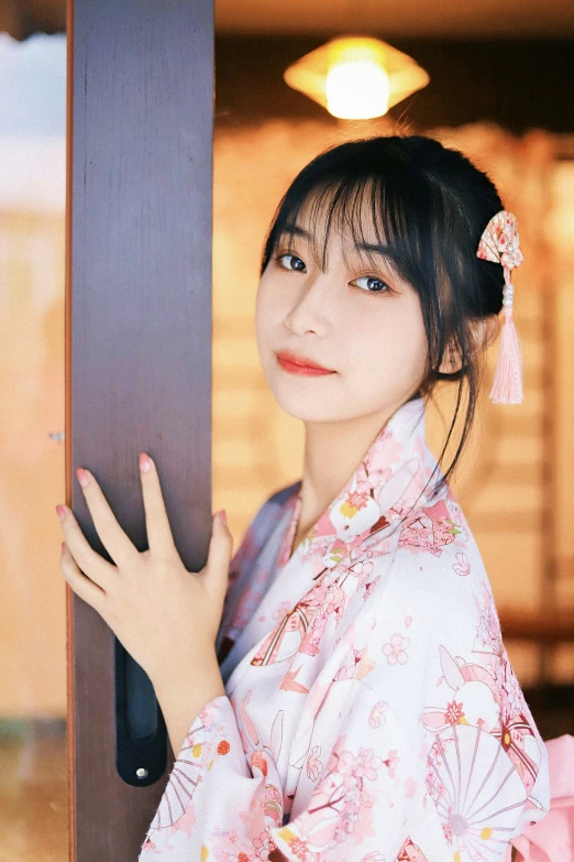 a woman in a kimono posing for the camera