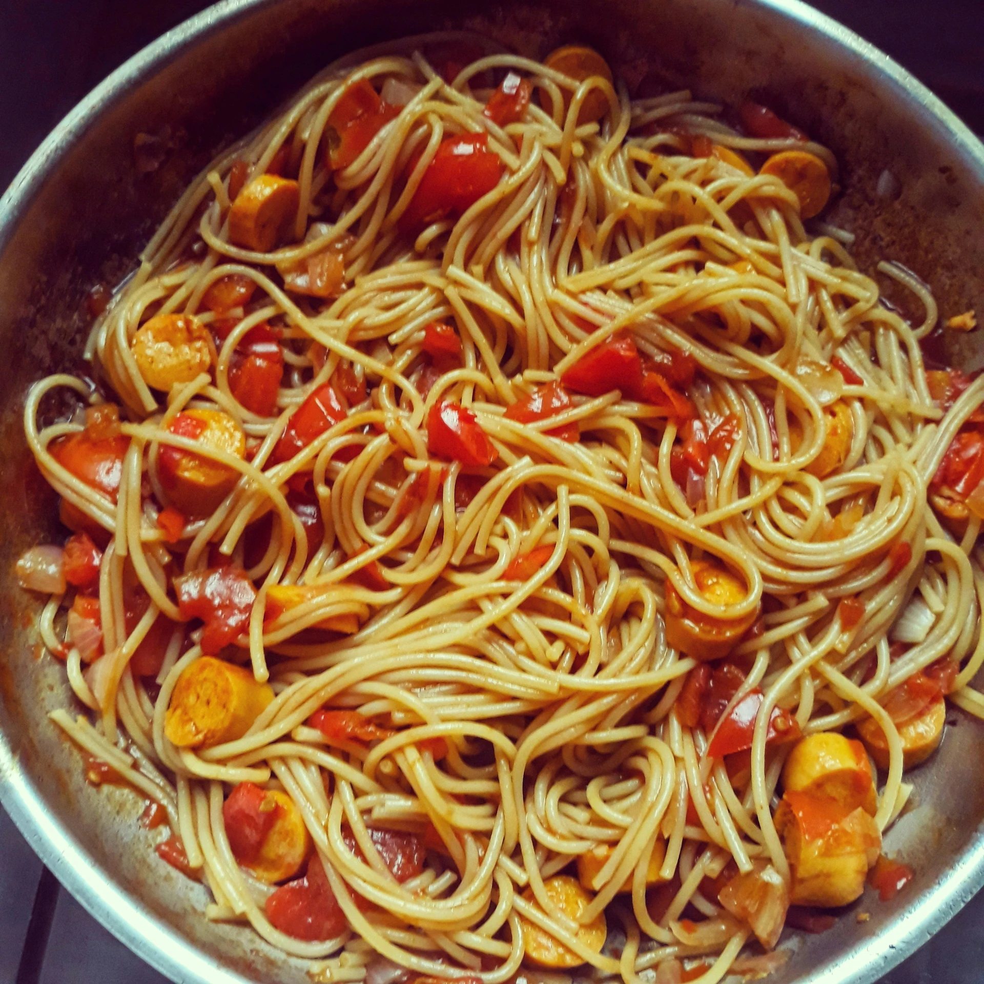 some pasta and other ingredients are in a pot