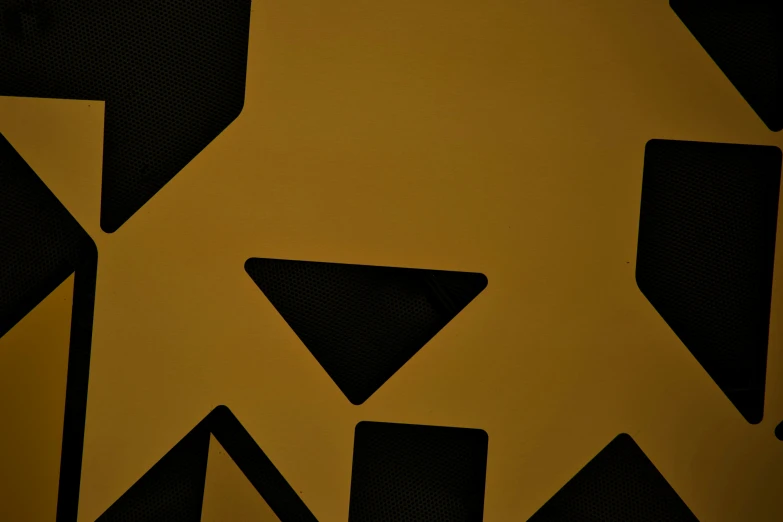 a closeup of an art deco design with black and gold colors