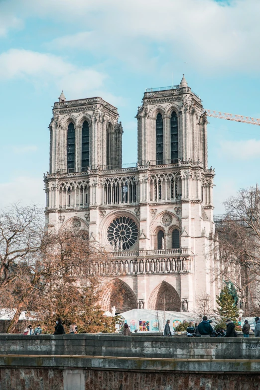 a large cathedral with towers and a sky background