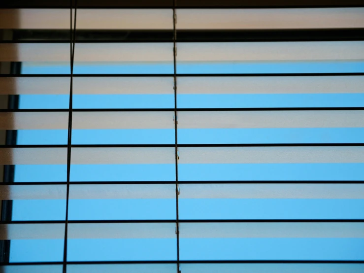 a window with horizontal and vertical shades with no blinds