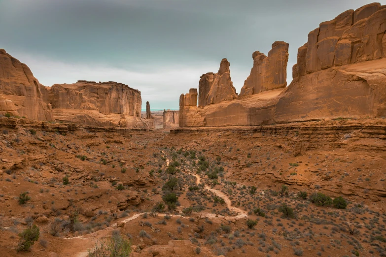 a large rock formation sitting in the middle of a desert