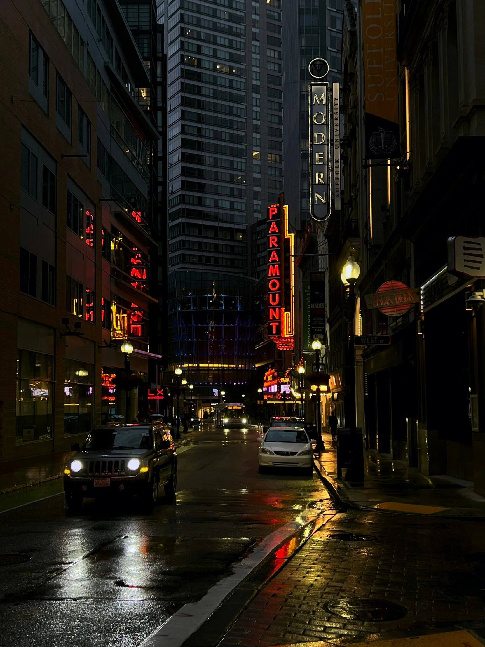 traffic moves through a busy city at night