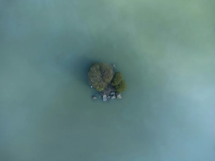 two people on an island in the middle of a lake