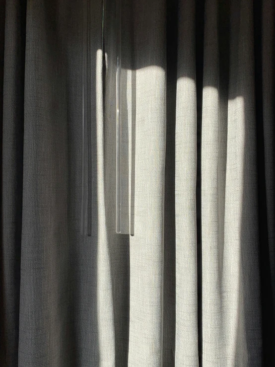 a curtain with shadows cast from it