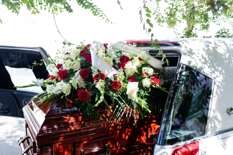 flowers sit in the back of an open car