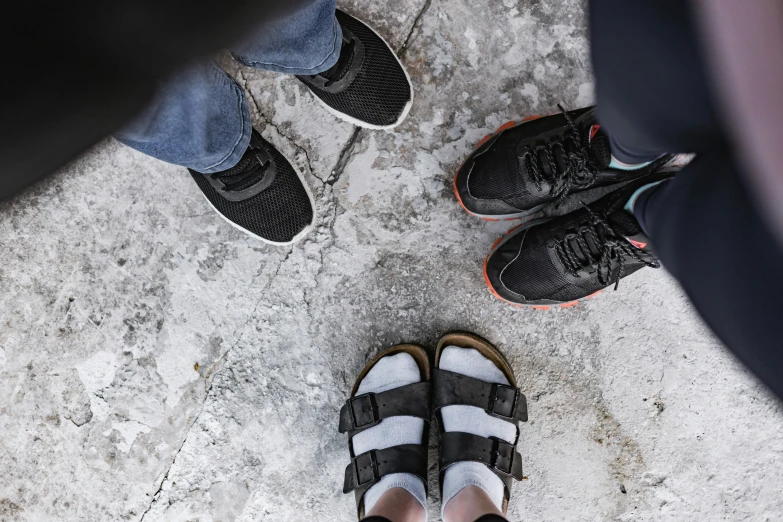 a group of people's feet with sandles on