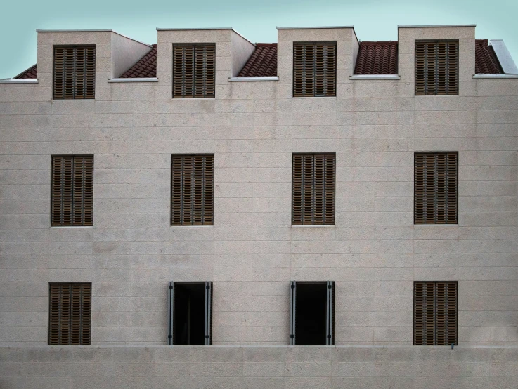 a building with several windows and a clock