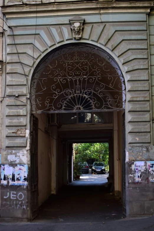 a doorway with a metal fence to it near a building