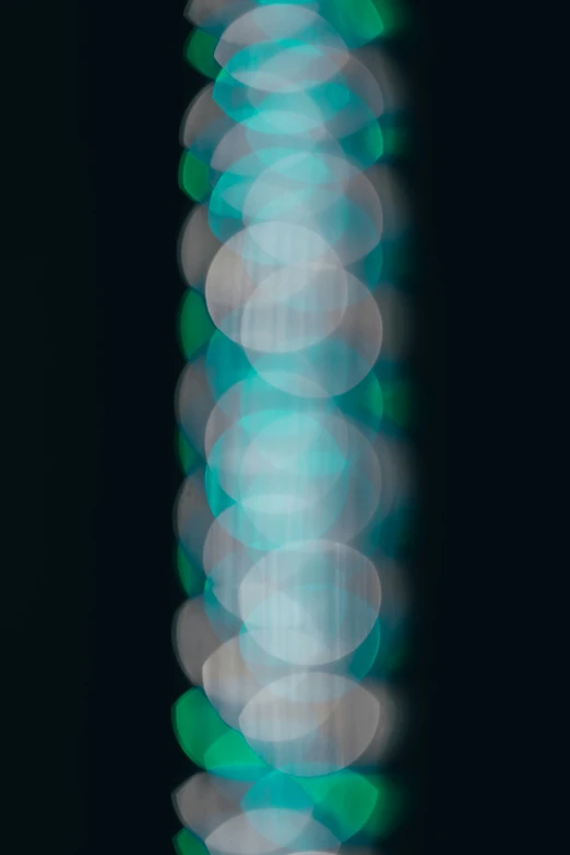 a light that is green and has some white circles