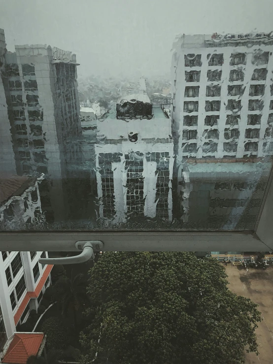 view from inside of an apartment building from an up high window