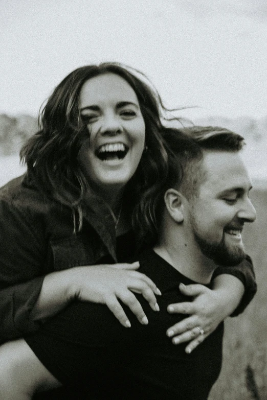 black and white po of a woman and man laughing