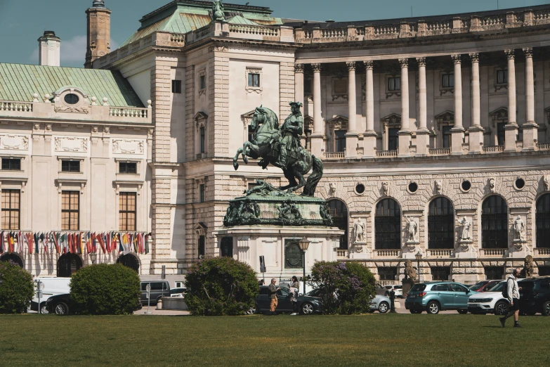 a large building with a statue in front of it