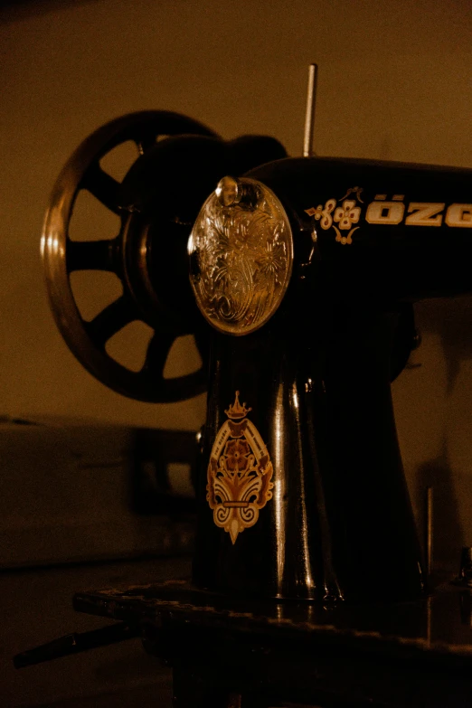 an antique sewing machine is set up with two wheels