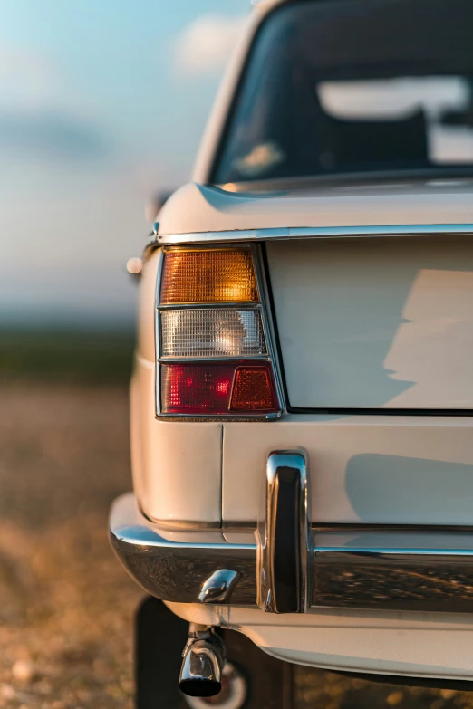 a car is parked out on the dirt