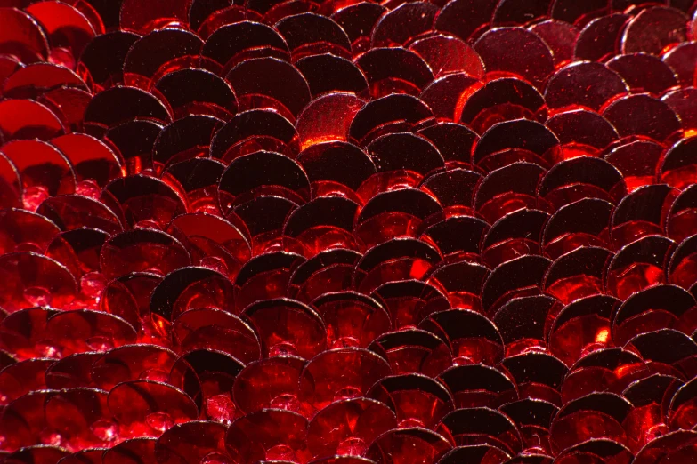 a pile of red plastic discs on a table