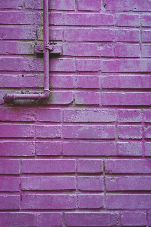 a brick wall that has soing shaped like a square