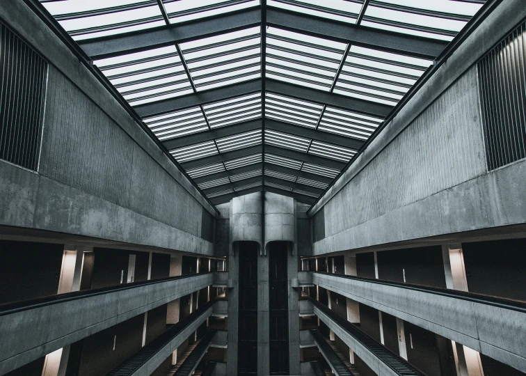 an open roof of a building with glass