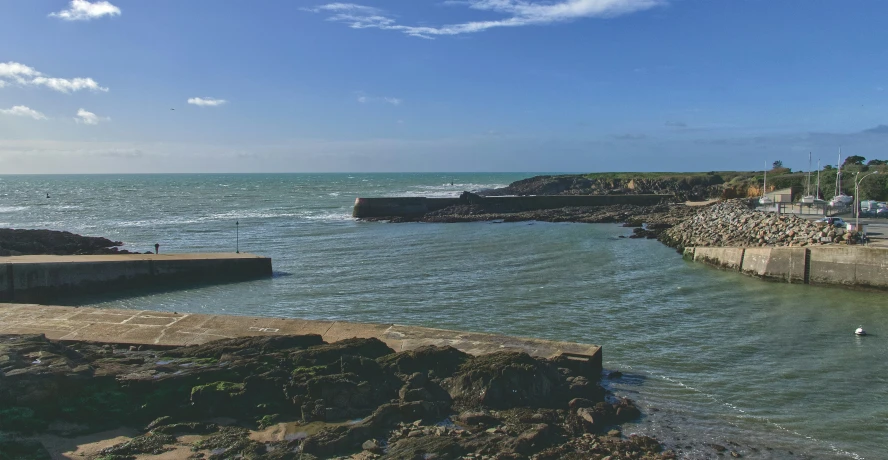 the water has two large cement jetty at the beach