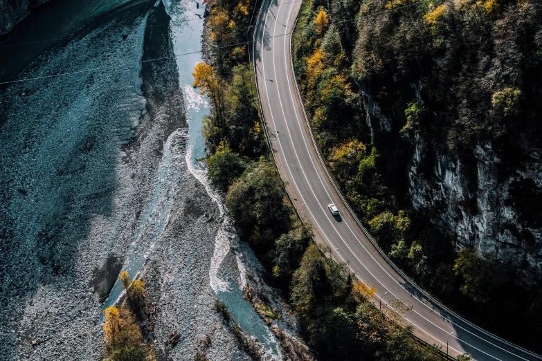 aerial s of two cars passing on a highway