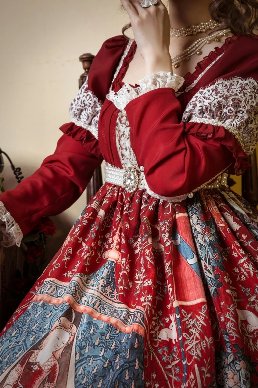 woman in traditional dress blowing bubbles near mirror