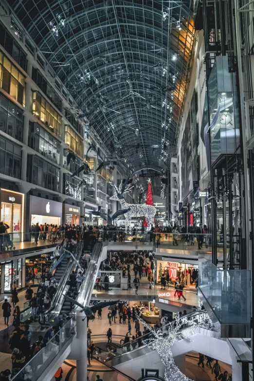 people standing and walking inside a large building