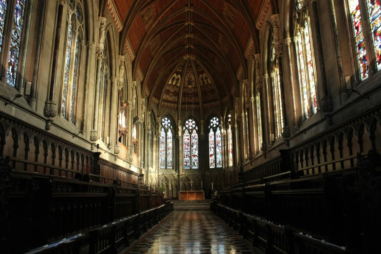 a large cathedral has stained glass windows and arches