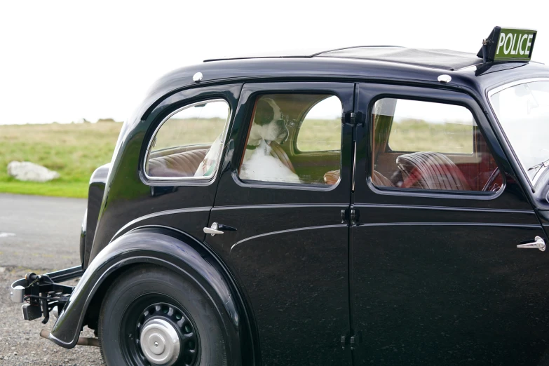 there is a small black car with a bride on top