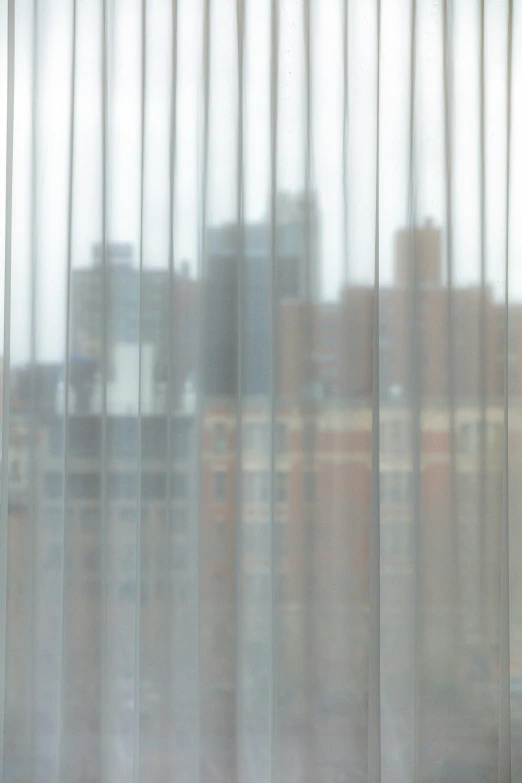 abstract view of curtains looking out on a city