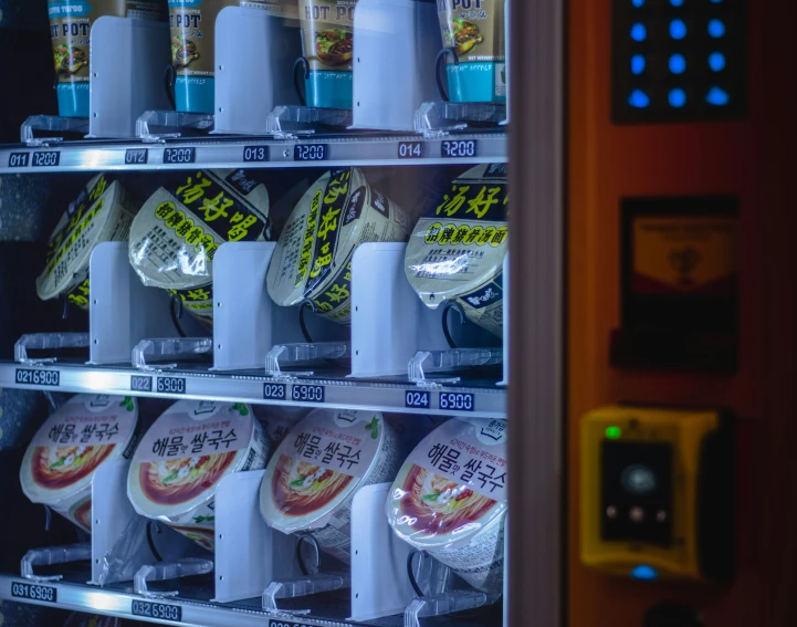 a vending machine full of various varieties of corn