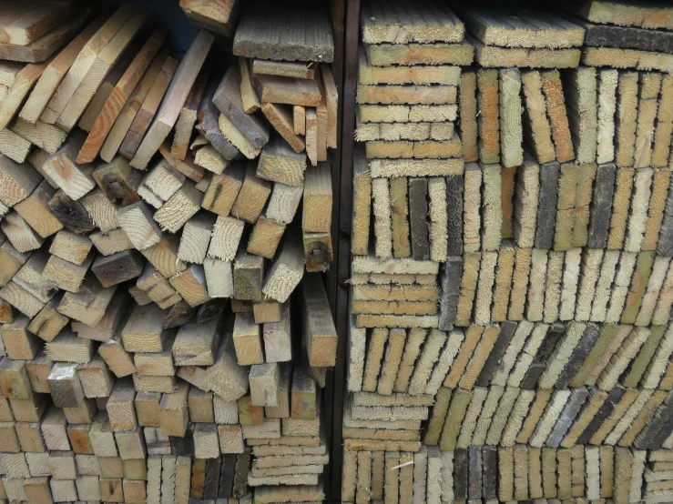 stacks of logs stacked together for a wall decoration