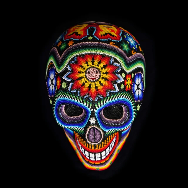 a painted skull is lit up in the dark