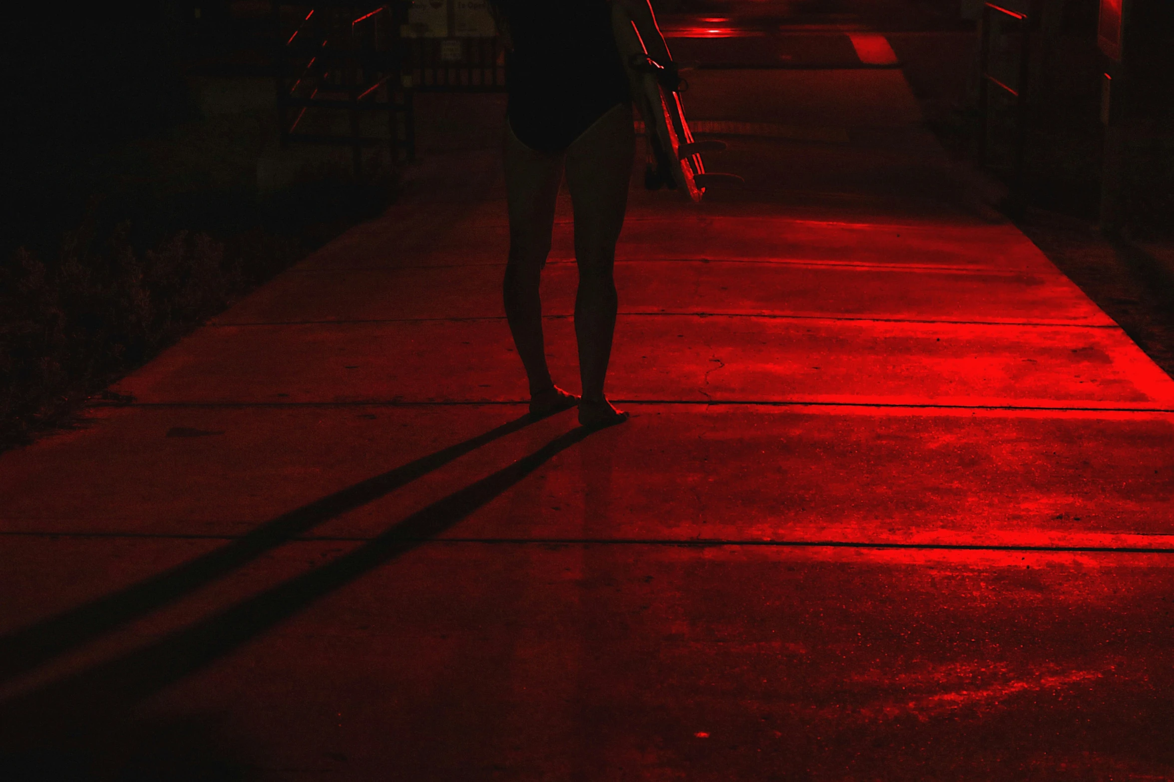 the girl walks down the road with an umbrella