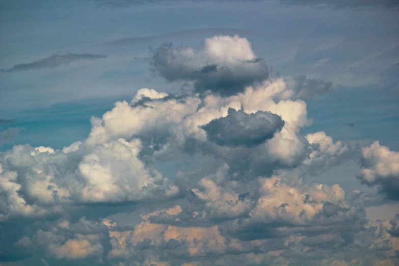 a large cloud formation over a rural city