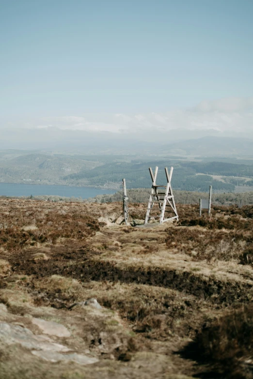 a wooden structure stands out in a barren landscape