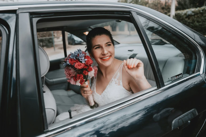 the woman is getting out of the car