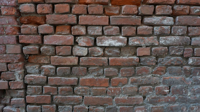 a stone wall made up of different colors