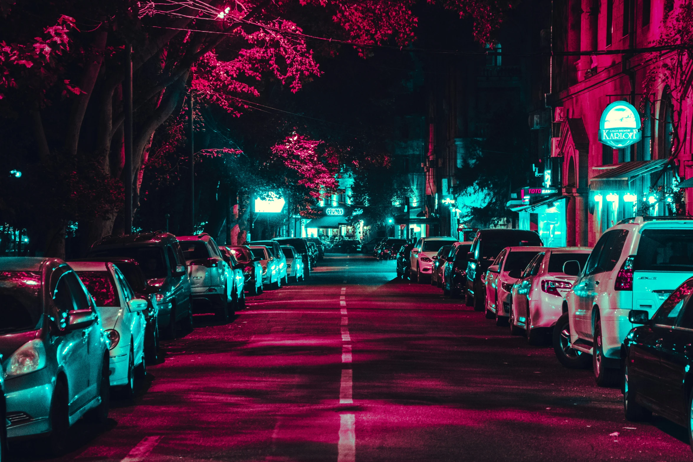 a street with a red light filled with cars