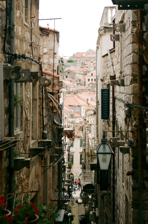 an alley way in the middle of town with many buildings