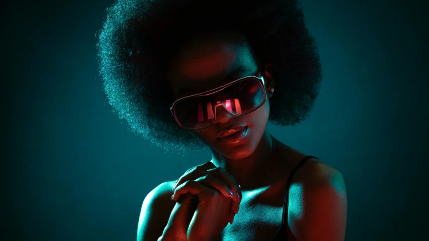 a young woman is wearing sunglasses while she has her hands on her chest