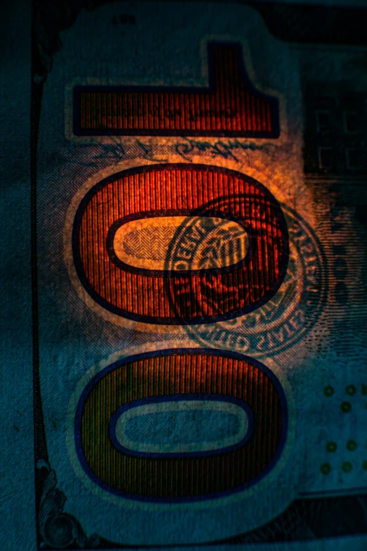 a close - up of a lit up street sign and an illuminated dollar bill