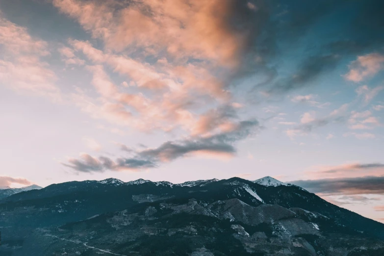 mountains in the distance with cloudy skies