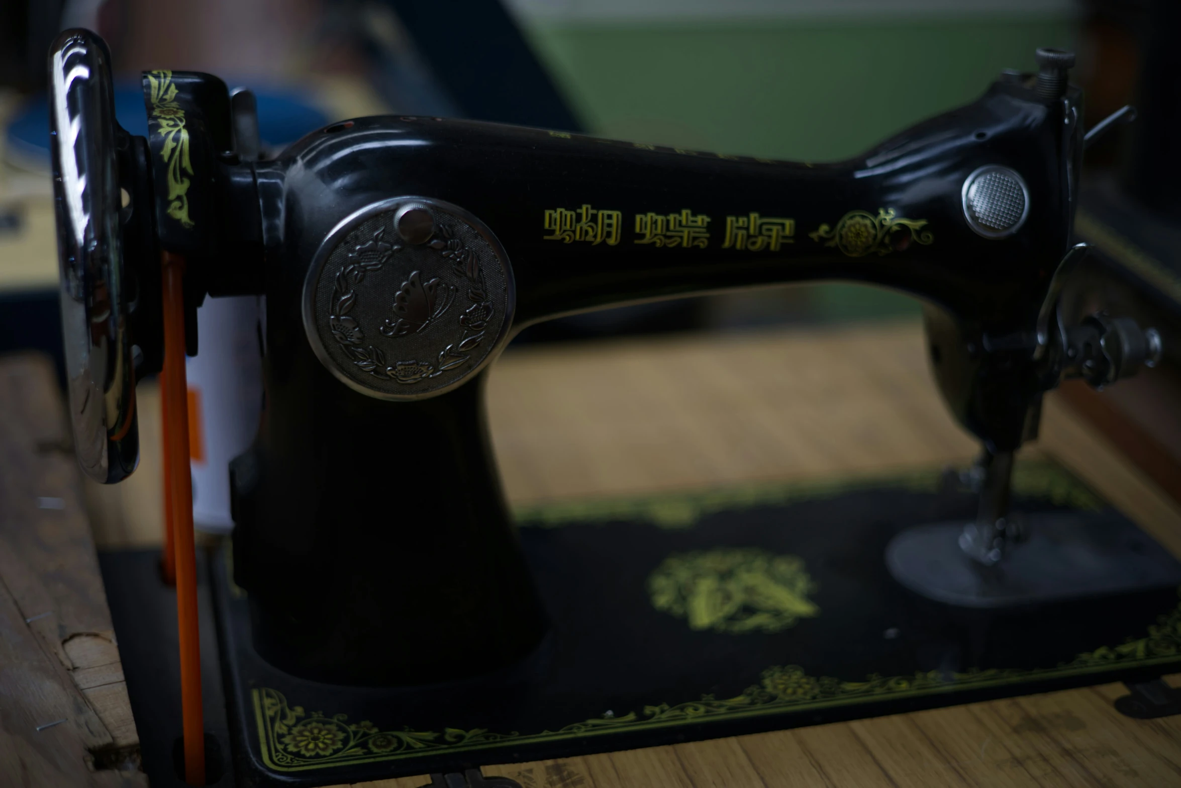 the sewing machine is close up on the table