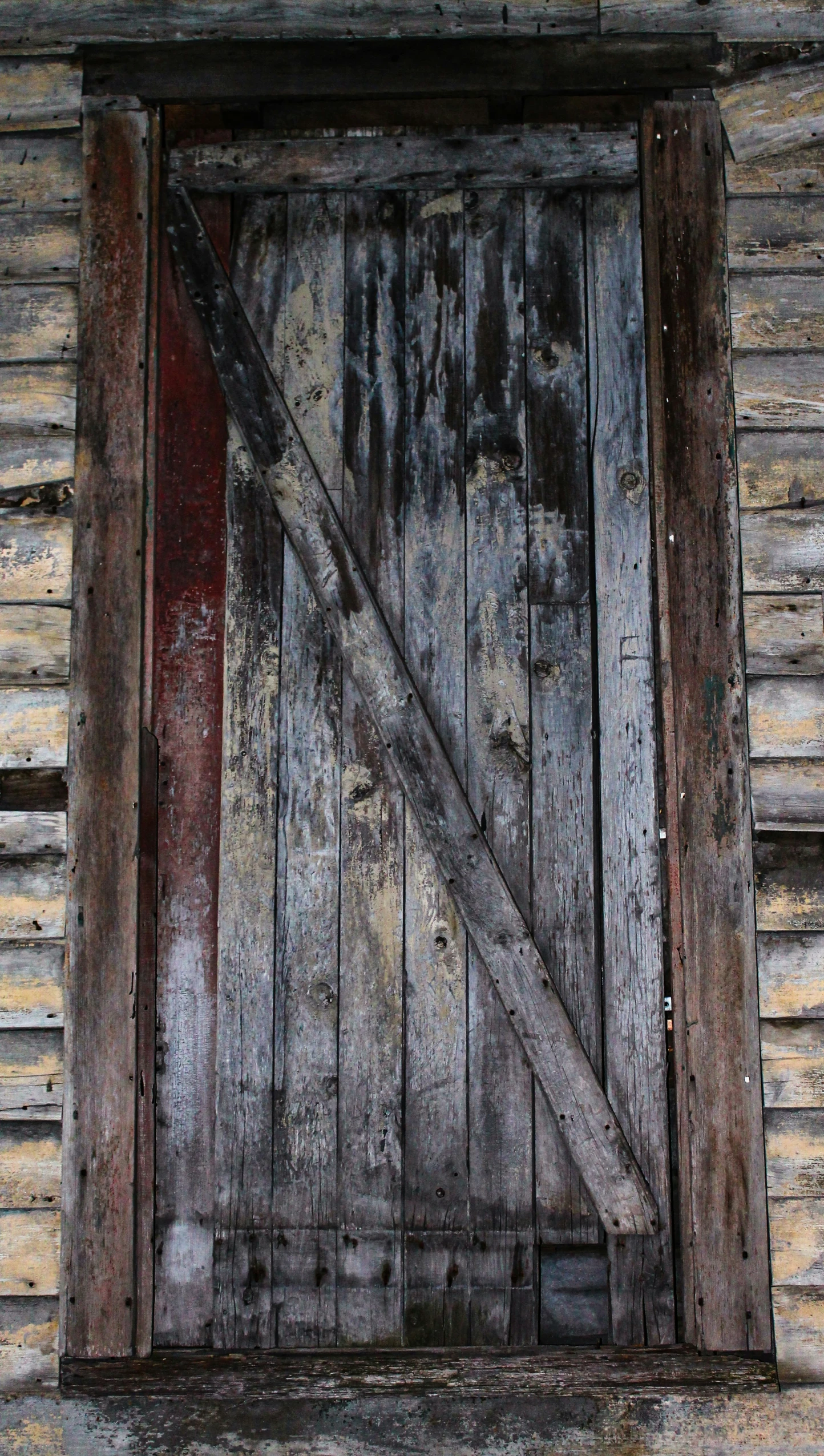 an old door with the rusted out metal hardware