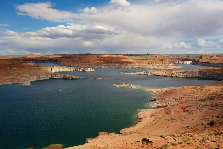 a deep, clear blue lake with cliffs and large cliffs