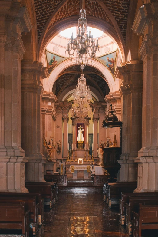 interior view of a building with ornate pews