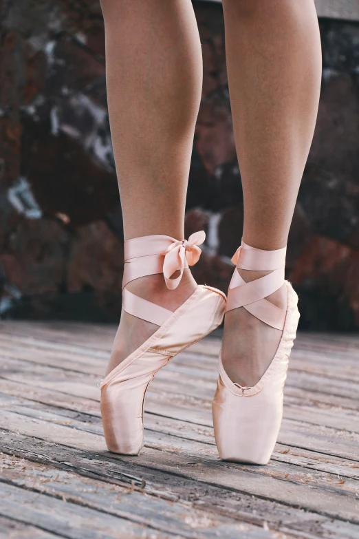 the legs and toes of a female ballet dancer