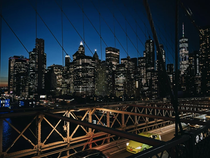 city lights lite up the night sky in the foreground