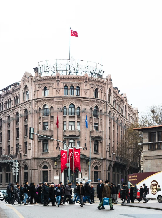 people standing in front of a large building